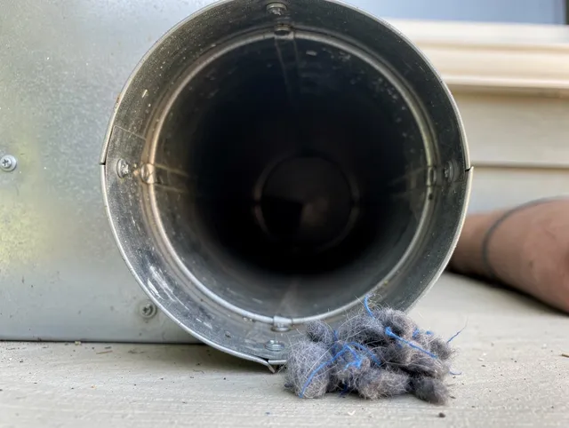 San Gabriel Dryer Vent Cleaning technician using specialized equipment to clear severe dryer vent blockage in San Gabriel